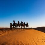 People riding on camels in Merzouga desert - 3 days from Marrakech to Merzouga