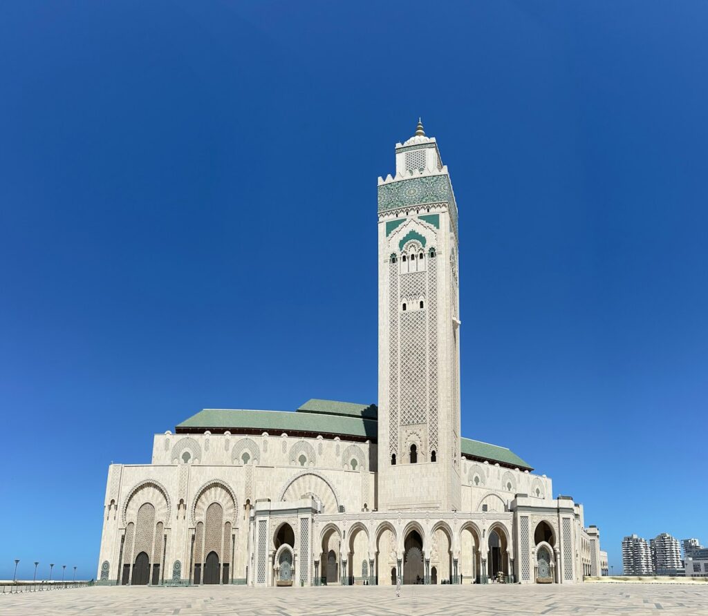 a large white building with a clock tower